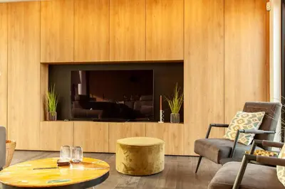 a living room with a tv and a coffee table at 8P 4B Luxury Villa Close to Maastricht in Lanaken