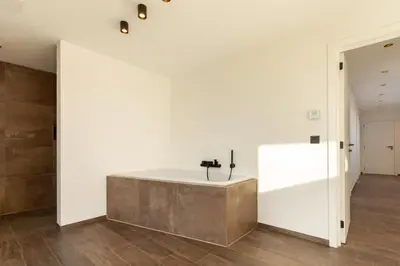 a bathroom with a bath tub in the middle of a room at 8P 4B Luxury Villa Close to Maastricht in Lanaken