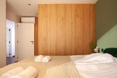 a bedroom with a bed with towels on it at 8P 4B Luxury Villa Close to Maastricht in Lanaken