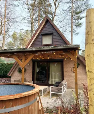 a house with a pergola and a patio at Wonderwild E87, Connect to nature & Dog Friendly in Lanaken