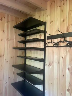 a black shelving unit in a wall at Lysdann Zutendaal in Zutendaal
