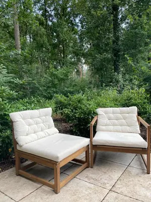 two chairs sitting next to each other on a patio at Lysdann Zutendaal in Zutendaal