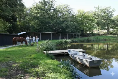 a group of people and a horse and a boat at Homestorys Nature Resort - Lakeview Pavilion in Eupen
