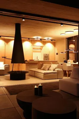 a living room with two white couches and a table at Homestorys Nature Resort - Lakeview Pavilion in Eupen