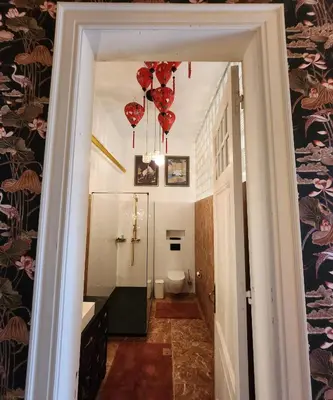 a hallway with red hearts hanging from a ceiling at Kasteel Rosmeulen in Mall