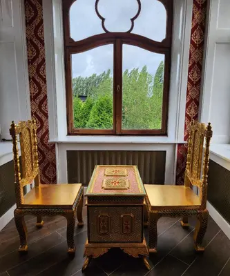 a table and two chairs in front of a window at Kasteel Rosmeulen in Mall