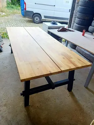 a wooden table sitting on top of a table at La Vie en Rose in Ensival