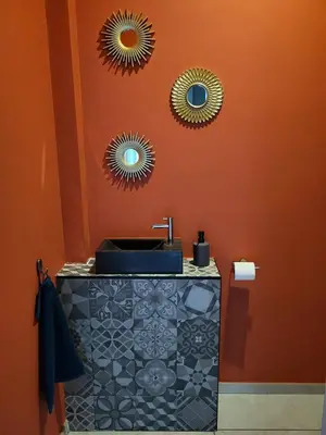 a bathroom with a sink and two mirrors on the wall at Charming 2-Bedroom House Rental in Dalhem, Belgium in Dalhem