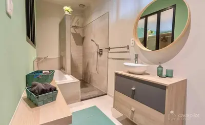 a bathroom with a sink and a mirror at Charming 2-Bedroom House Rental in Dalhem, Belgium in Dalhem
