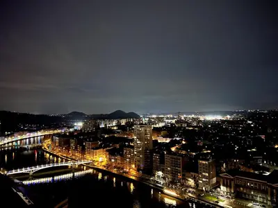a view of a city at night with a bridge at Casa Cielo-Spectacular View-Center-Chic-Spacious in Liège