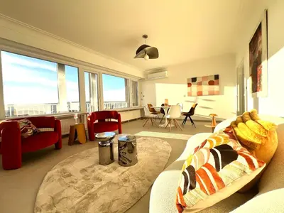a living room with a couch and a large window at Casa Cielo-Spectacular View-Center-Chic-Spacious in Liège