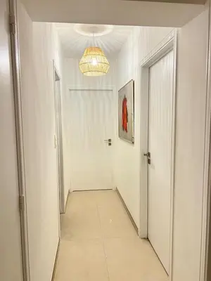 a hallway with a door and a chandelier at Casa Cielo-Spectacular View-Center-Chic-Spacious in Liège