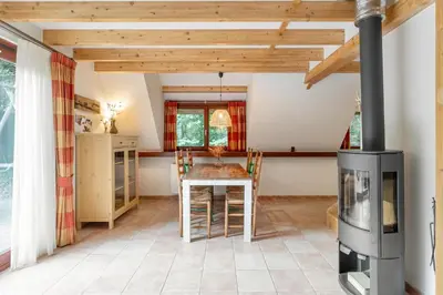 a kitchen with a table and a stove at Riet&Rust in Lanaken