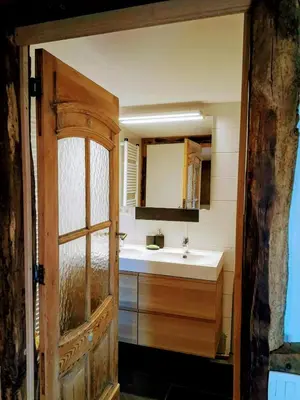 a bathroom with a sink and a mirror at Au coeur de l'Ardenne - Peaceful loft in Baelen