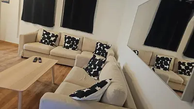 a living room with a couch and a table at Logement Sam in Liège
