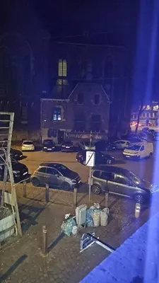 a group of cars parked in a parking lot at Logement Sam in Liège