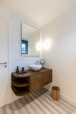 a bathroom with a sink and a mirror at Theodore Schwann - duplex centre de Liège in Liège