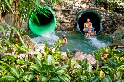 a group of people in the water in a pool at Center Parcs Apartments Erperheide in Peer