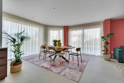 a dining room with a table and chairs at 't Vennehuys in Genk
