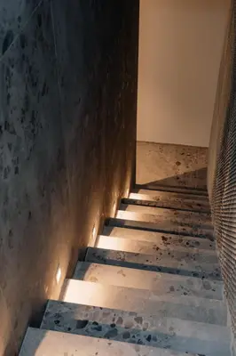 a stairway leading up to a building with lights at Coliving - Bord de Meuse - L'atelier de la Meuse in Oupeye