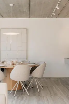 a dining room with a wooden table and chairs at Coliving - Bord de Meuse - L'instant in Oupeye