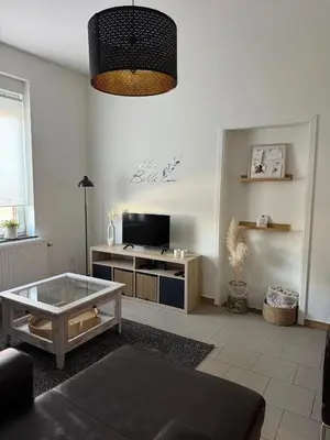 a living room with a couch and a coffee table at Charming Apartment in Lontzen on 72 m² in Lontzen