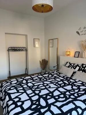 a bedroom with a large black and white bed at Charming Apartment in Lontzen on 72 m² in Lontzen