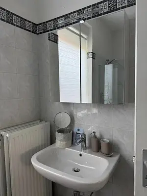 a bathroom with a sink and a mirror at Charming Apartment in Lontzen on 72 m² in Lontzen