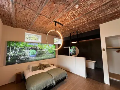 a bedroom with a bed and a large painting on the ceiling at L'Orée des Thermes in Chaudfontaine