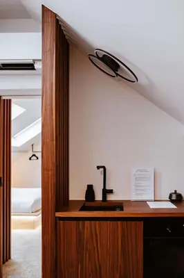 a bathroom with a sink in a room at Héritage Collection - Suites in Verviers