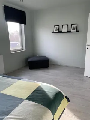 a room with a bed and a pillow on the floor at JoHa Haus in Hasselt