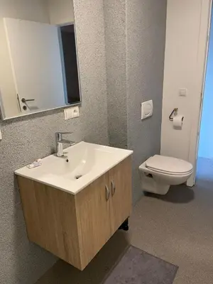 a bathroom with a sink and a toilet at JoHa Haus in Hasselt