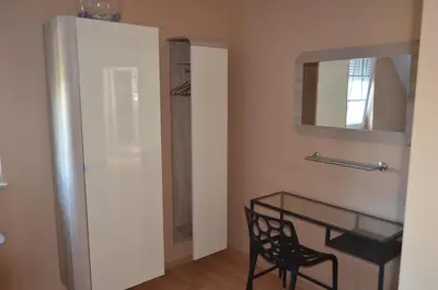 a dining room with a glass table and a mirror at Holiday Home Mooi - Voeren in Voeren