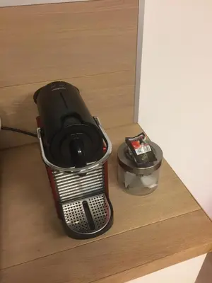 a gaming system sitting on top of a drawer at Studio Peralta in Liège