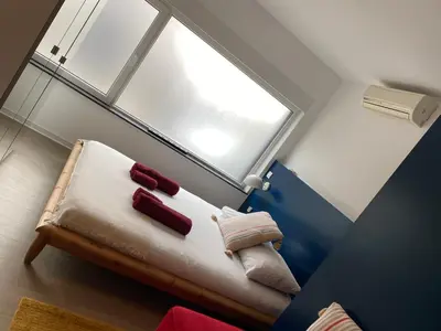 a bench in a room with a window at Studio Peralta in Liège