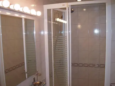 a bathroom with a shower and a mirror at Domein Hengelhoef in Houthalen-Helchteren