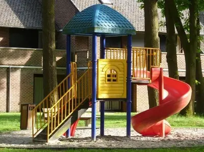 a childrens playground with a slide and a slideintend at Domein Hengelhoef in Houthalen-Helchteren