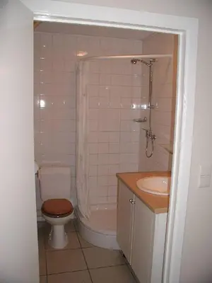 a bathroom with a toilet and a sink at De Bosbeekpoort in Oudsbergen