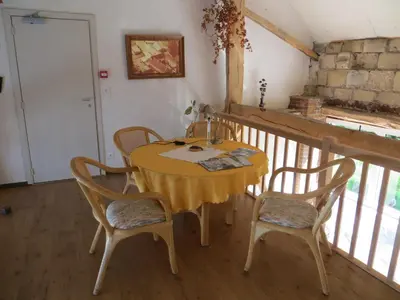 a yellow table and chairs in a room at De Aventurijn in Riemst
