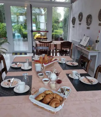 a table with bread and other food on it at De Aventurijn in Riemst