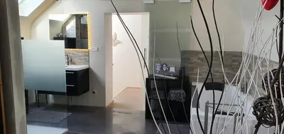 a bathroom with a sink and a mirror at La renaissance in Villers-lʼÉvêque