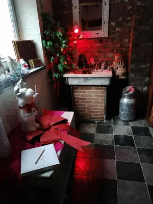 a kitchen with a sink and a counter with red lights at le gite de zoelie in Chaineux