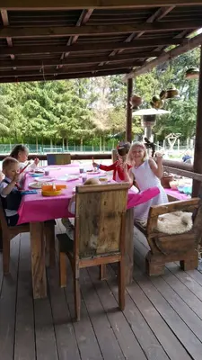a group of children sitting at a table at le gite de zoelie in Chaineux