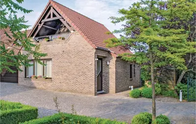 a brick house with a window on top of it at Holiday Home Kinrooi I in Kinrooi