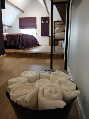 a room with a pile of towels on the floor at de Twie Keuninge in Maasmechelen