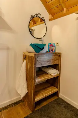 a bathroom with a sink and a mirror at Het Kloosterzicht in Borgloon