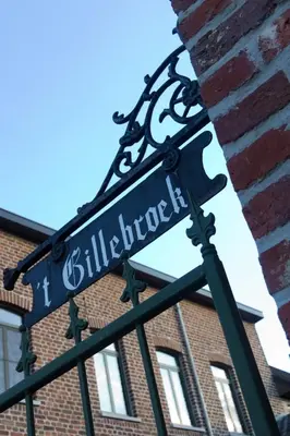 a street sign in front of a brick building at 't Gillebroek in Borgloon