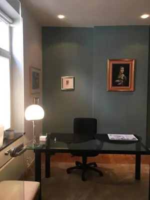 a glass desk in a room with a chair at Tongeren Schuttersgang 1 in Tongeren