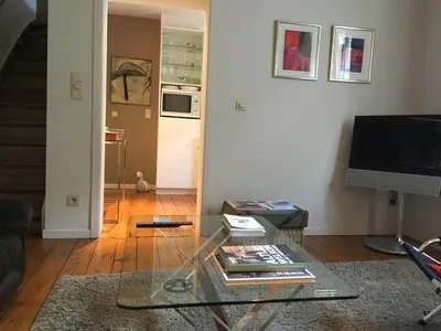 a living room with a glass coffee table at Tongeren Schuttersgang 1 in Tongeren