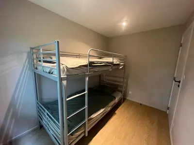 a bunk bed room with two bunk beds in it at Maison Léon in Bilstain